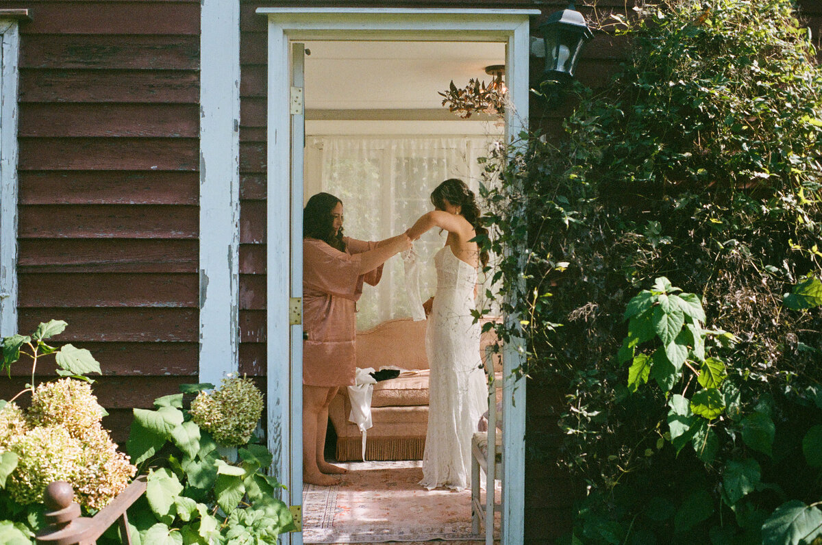 mother of the bride helping the bride get married 