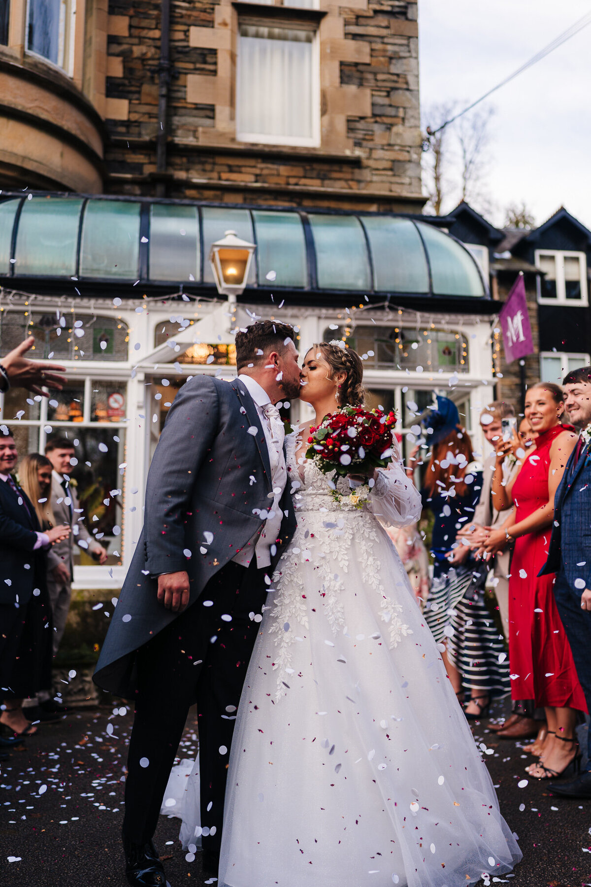 Outside confetti shot with bride and groom at Merewood  Country House Hotel taken by Anthony Horseman