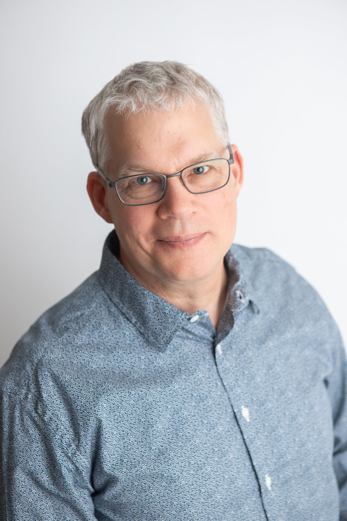 Edmonton studio headshots with a plain white backdrop