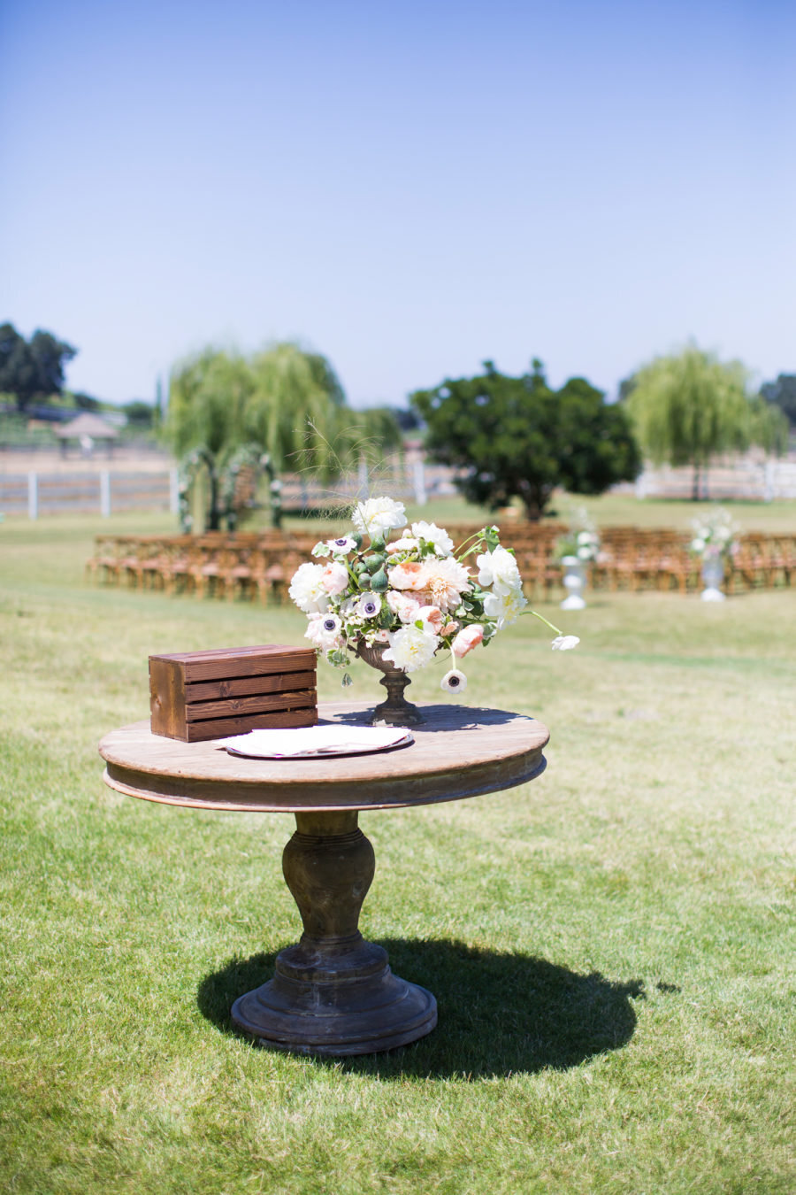 rustic wood table and flowers for wedding programs