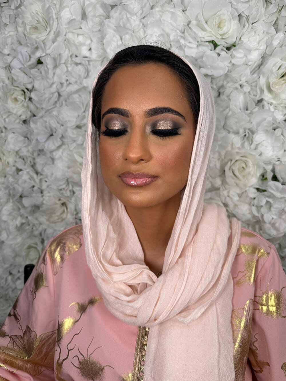 Bride dressed in a unique cultural wedding dress with full glam makeup by Skinlux Beauty Bar.