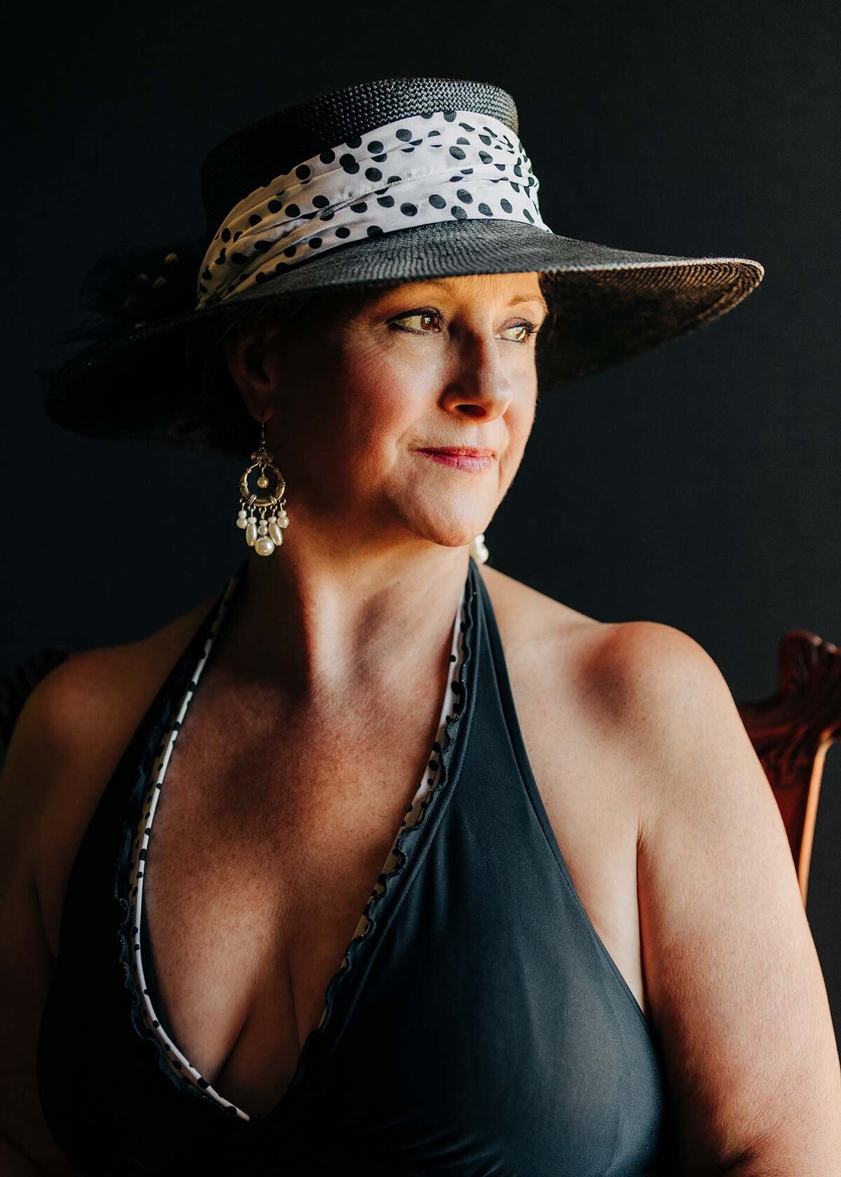 Low key portrait of Montana woman in black swimsuit