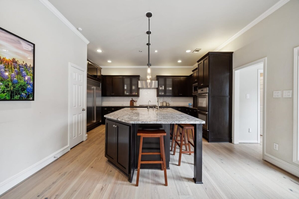 17828_cedar_creek_canyon_dr_dallas_tx_kitchen_with_large_granite_island_and_bar_seating_-_haven_realty_group