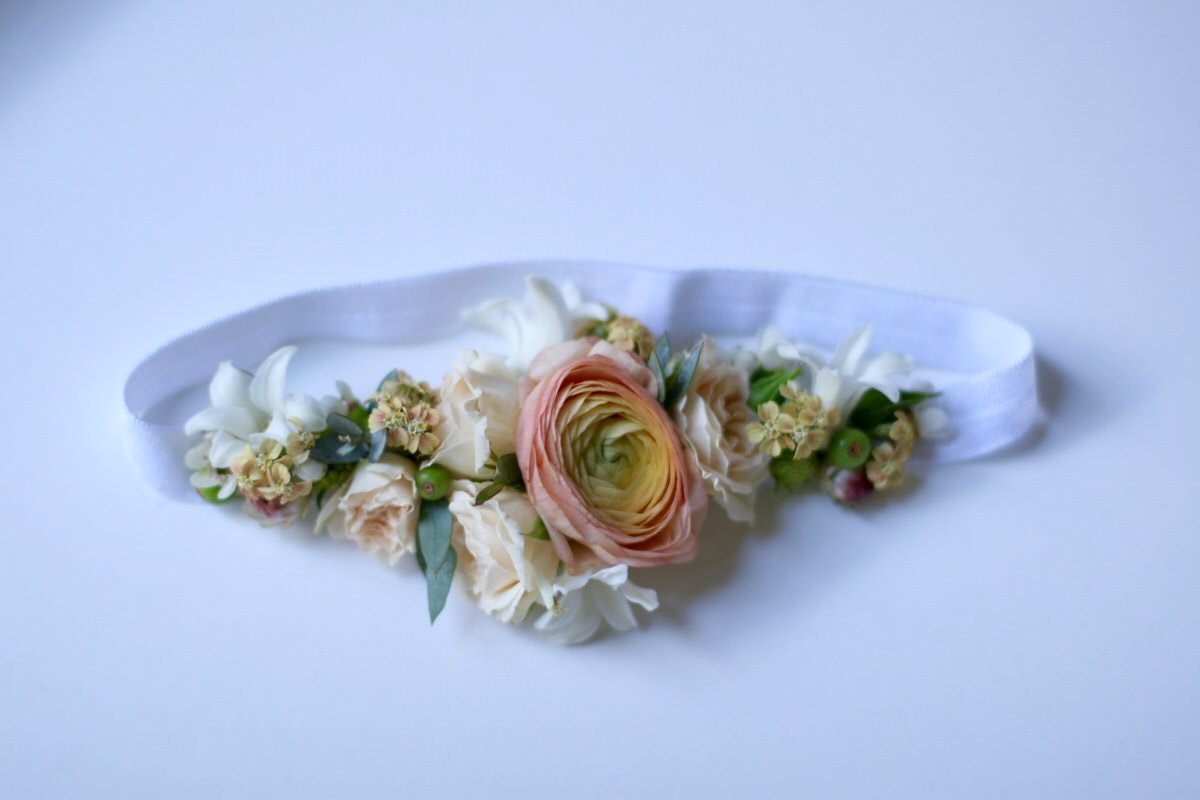 Floral headband flower crown for a baby in a blush wedding