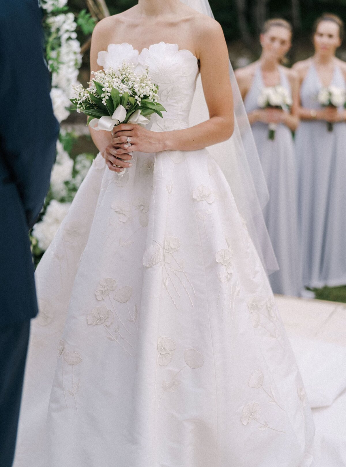 bride-white-dress-with-bouquet-her-hands-stands-groom-lawn