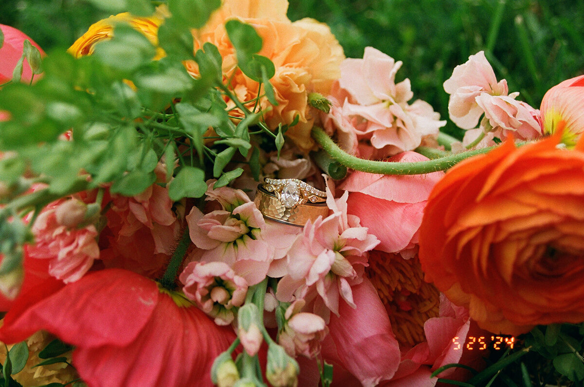 ring in brides bouquet on  wedding day