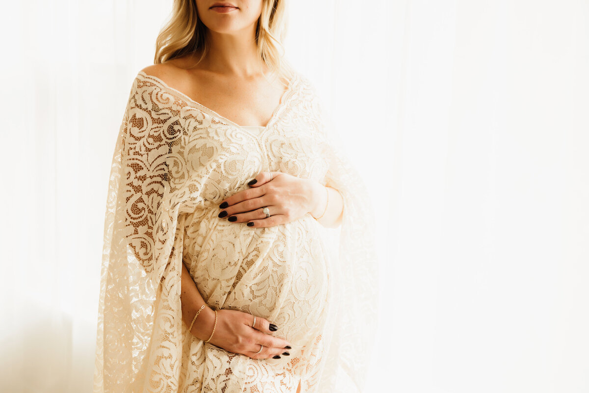 Central new york maternity session with mom wearing lace dress