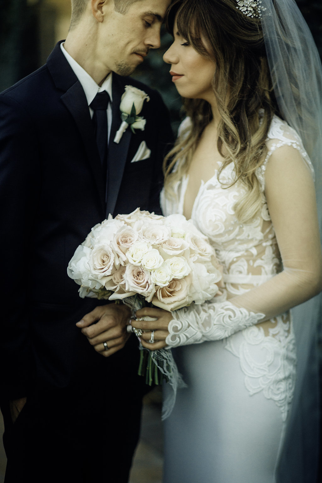 Wedding Photograph Of Bride Carrying a  Bouquet Next To Her Groom Los Angeles