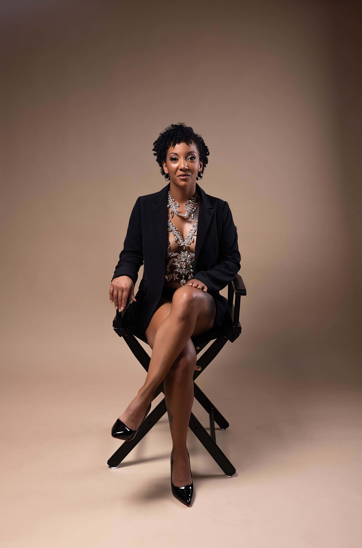 Woman sitting in chair for birthday session with Reva Davis photography