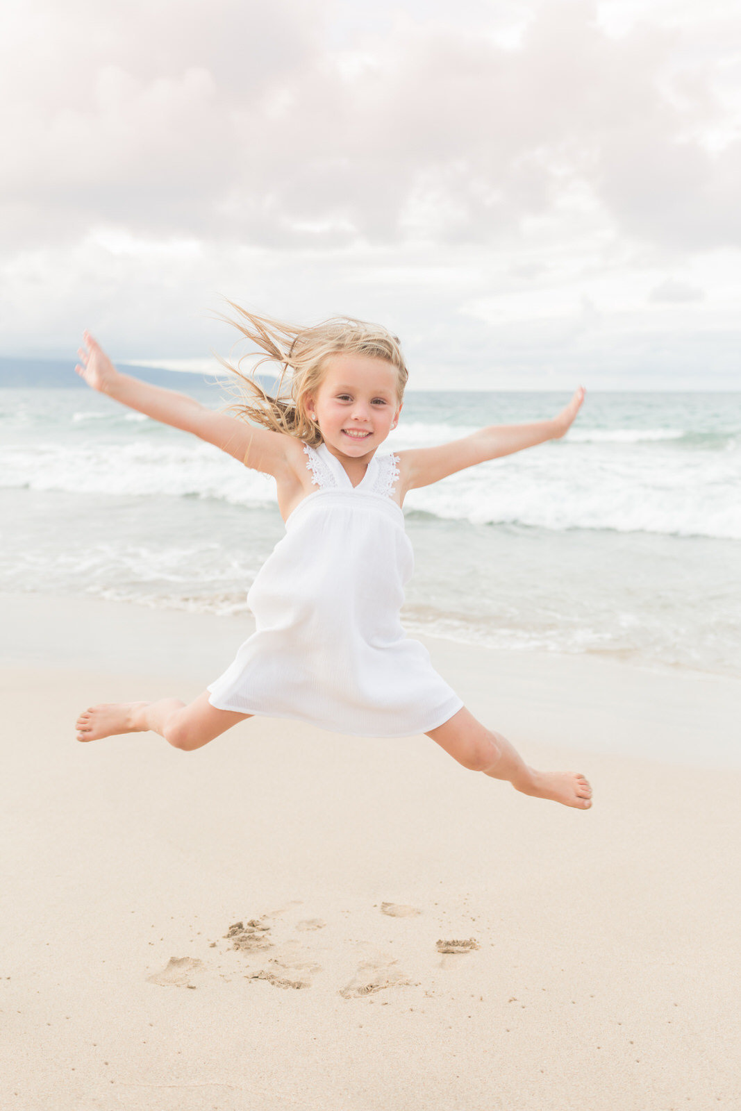 Maui family photography - girl jumping