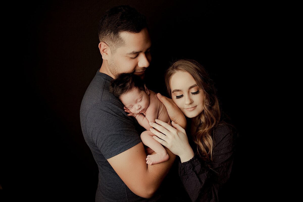 Black and white newborn photo showing detailed features and soft textures