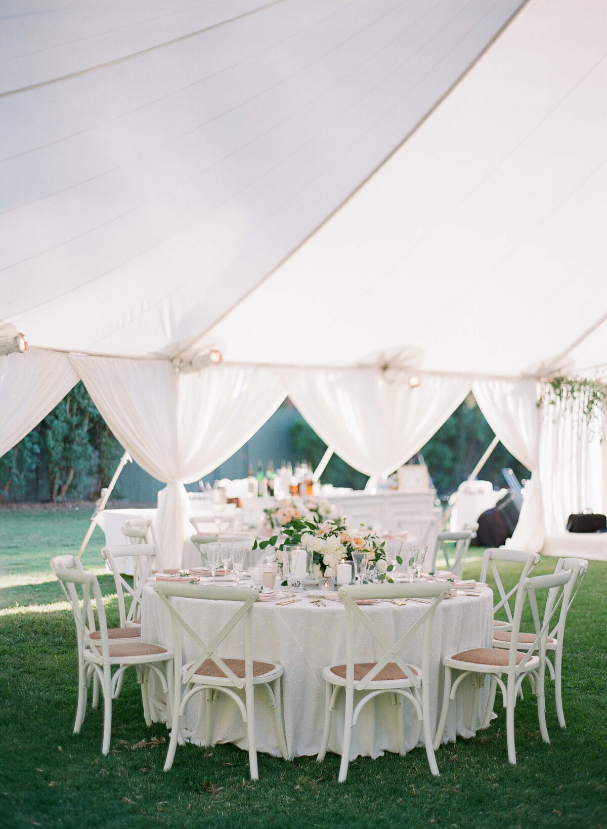 Wedding tables under an event tent in Ojai, California