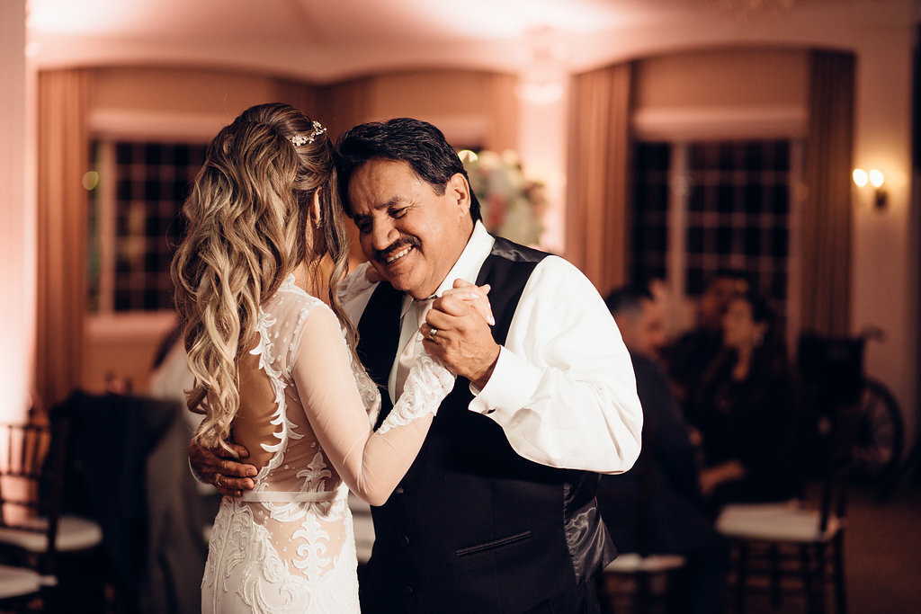 Wedding Photograph Of Man Smiling While Dancing With Bride Los Angeles