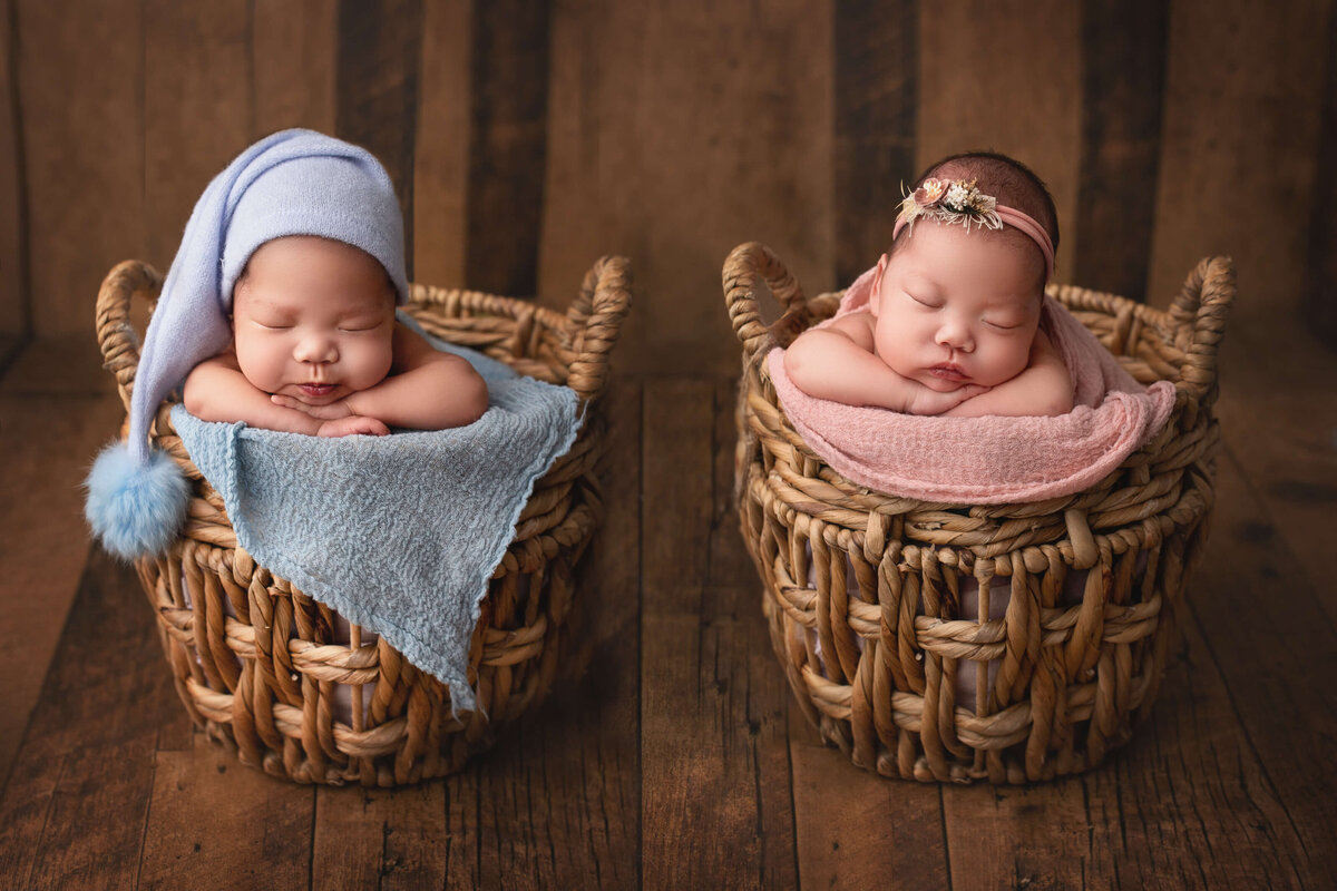 boy and girl twins posed in matching bamboo baskets during their hamilton newborn photoshoot