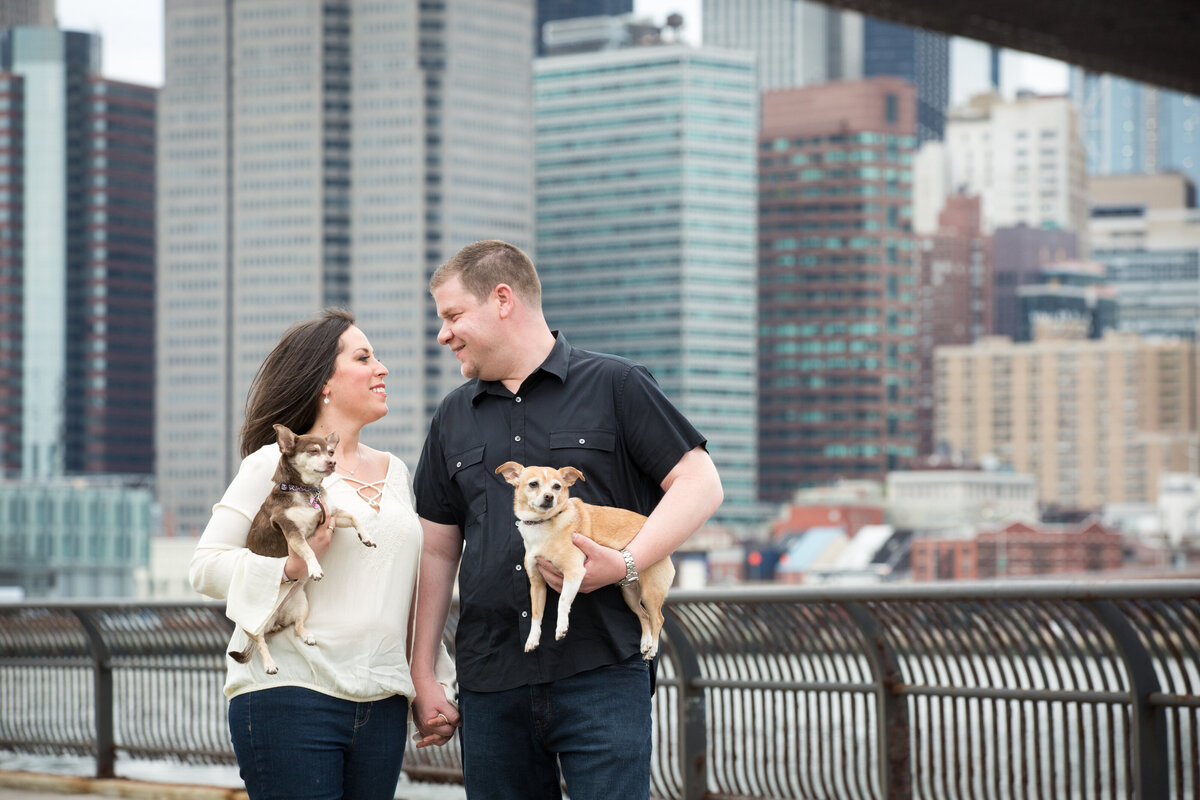 engaged couple with dogs