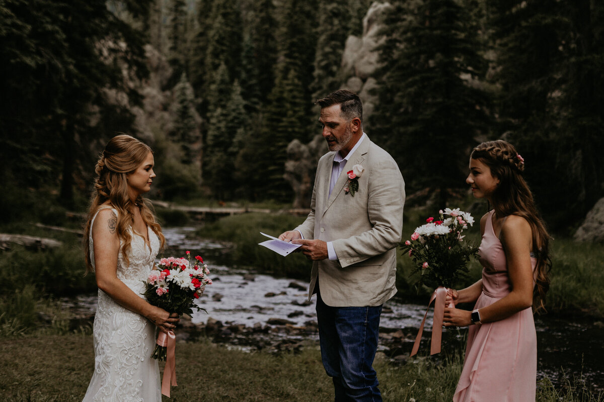 groom reading vows during their wedding ceremony