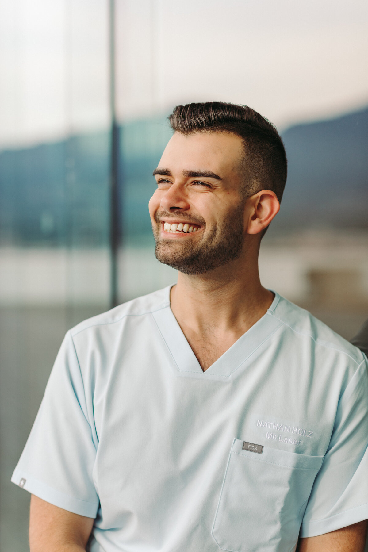 Utah Family Photographer captures man wearing white scrubs during brand photoshoot