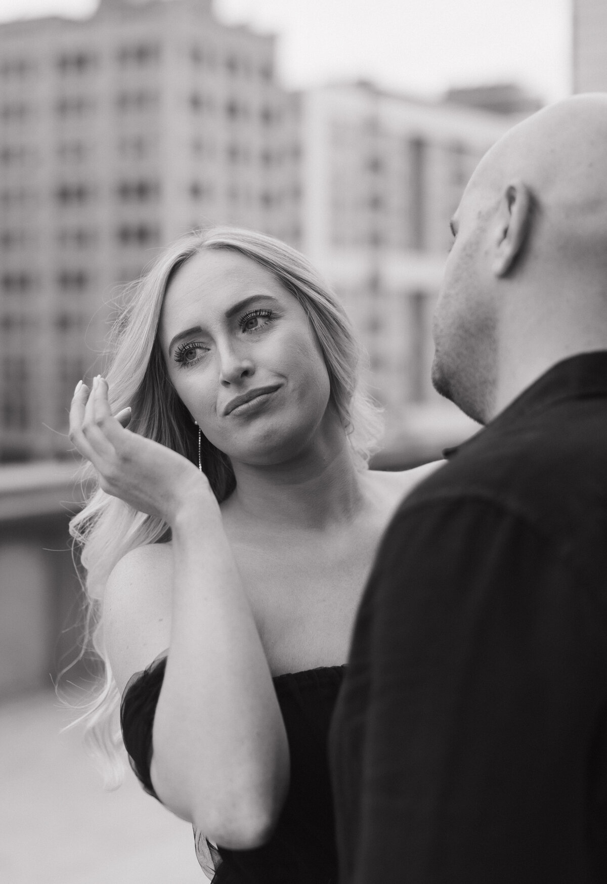 Indianapolis engagement photography candid rooftop session