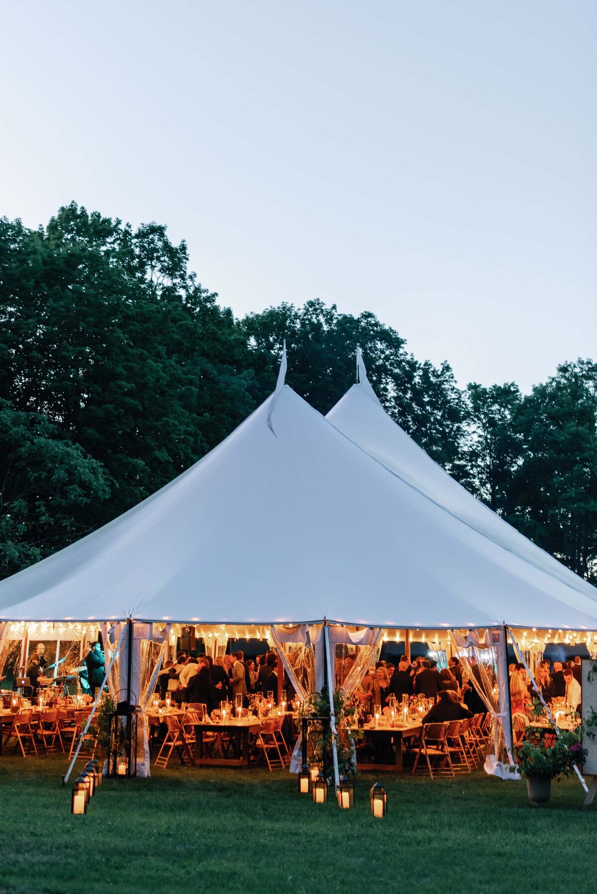 wedding tent illuminated in evening light with candles