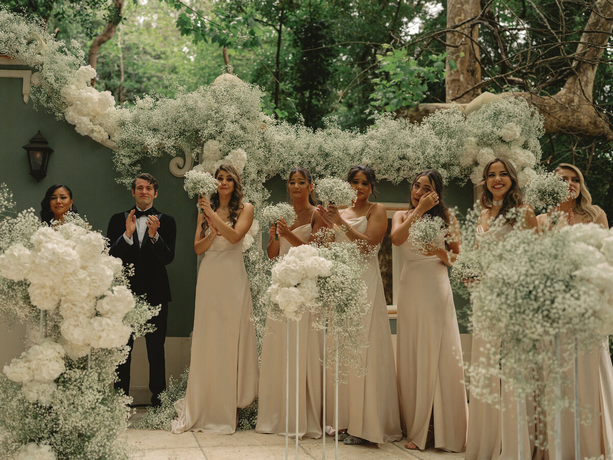 Bridesmaids crying as the bride enters the ceremony of a destination wedding in Quinta da Bellavista in Sintra, Portugal