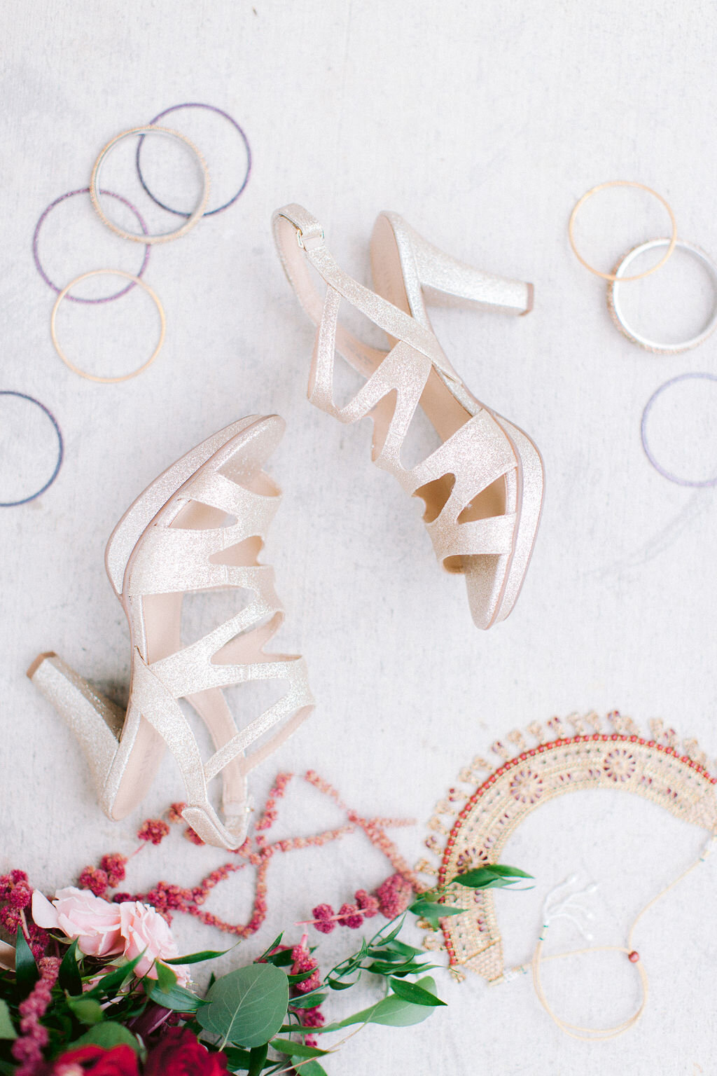 Detail shot of the Bridal shoes and braclets.