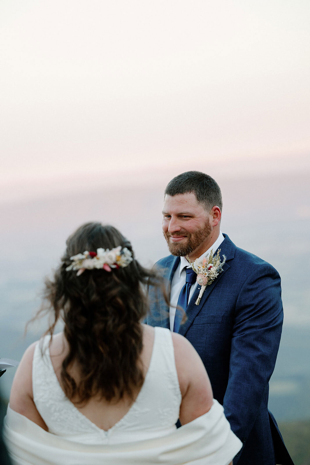 A groom smiling at his bride during their shenandoah elopement
