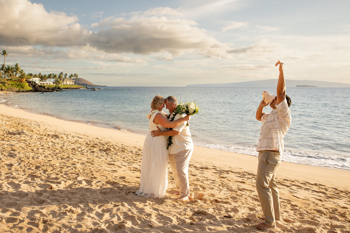 Maui Wedding Photographer captures couple celebrating on beach