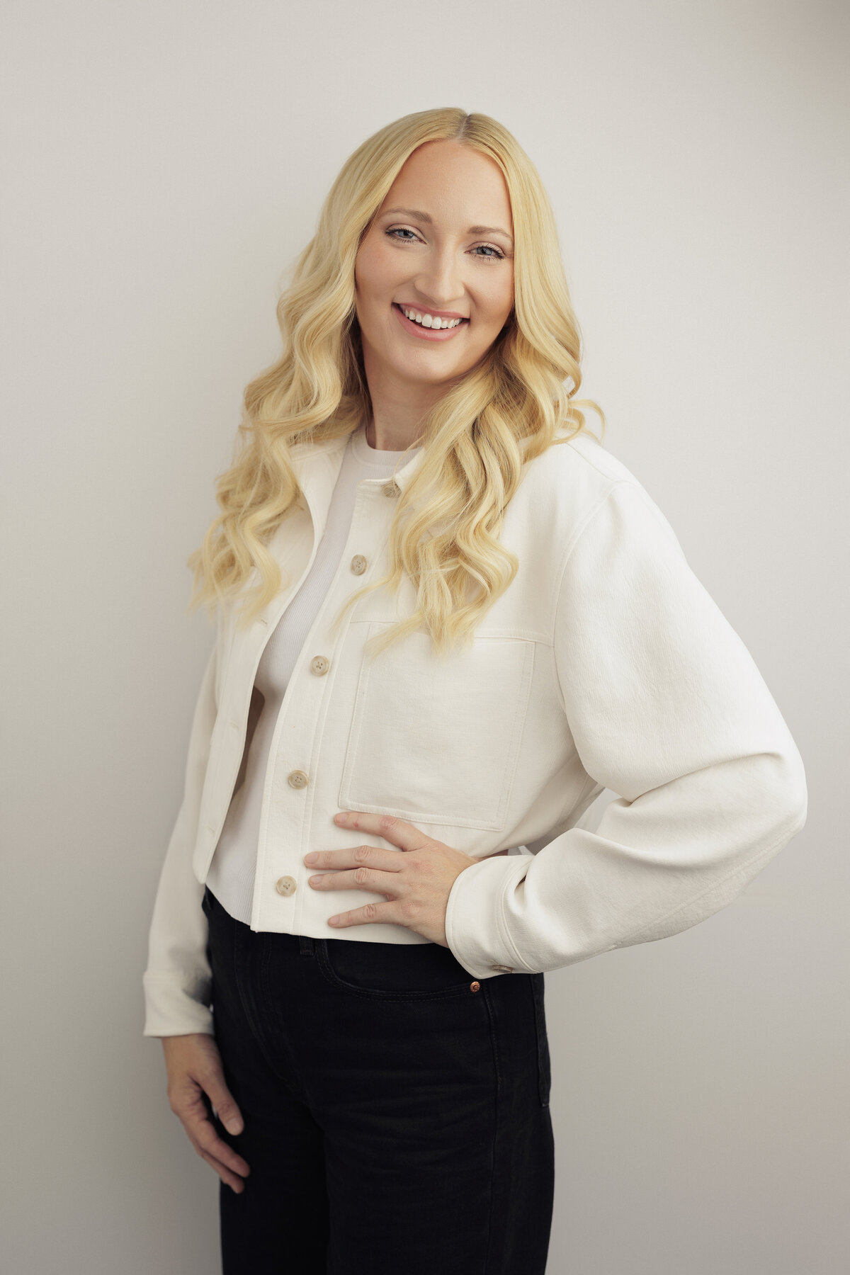 Modern headshot with soft studio lighting for a confident woman seeking updated branding images.