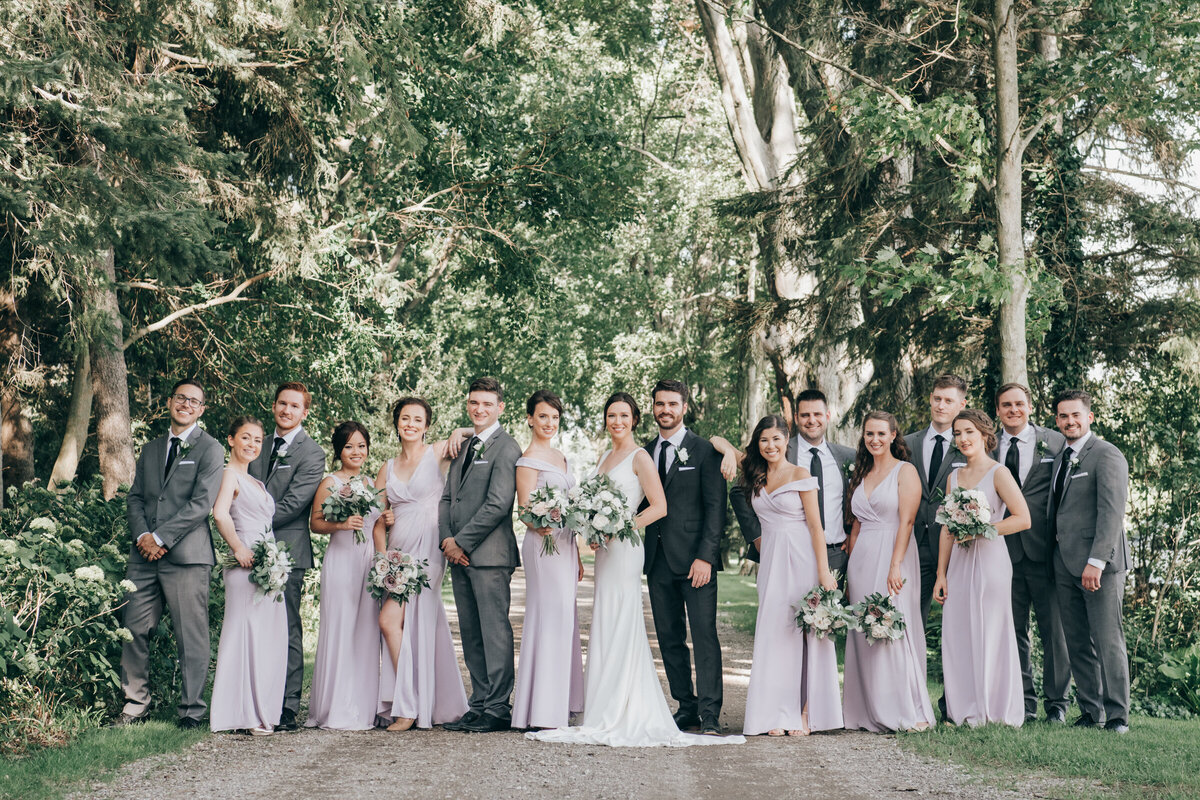 Wedding party wearing. lavender and grey fun on the wedding day