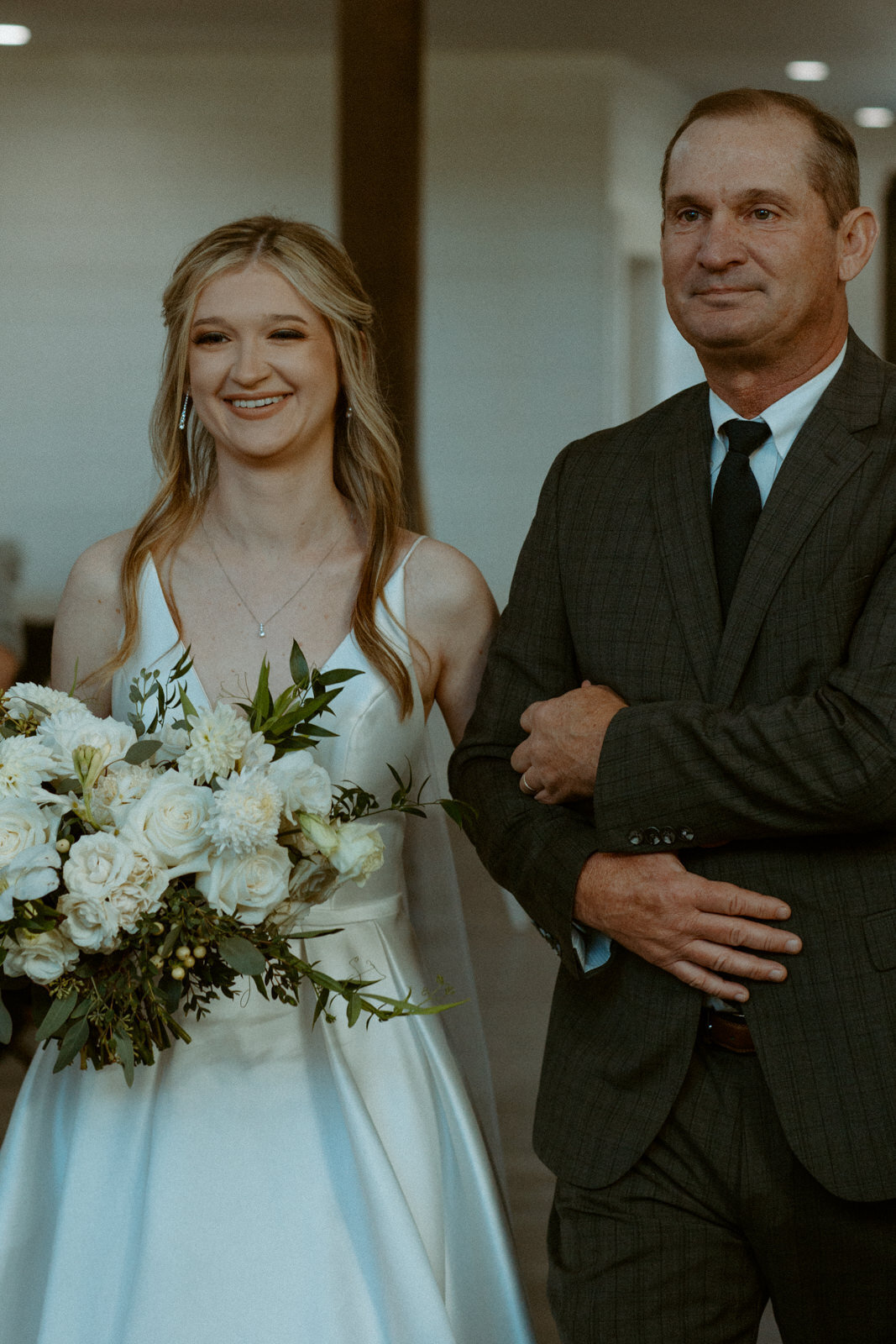 dad walking daughter down the aisle