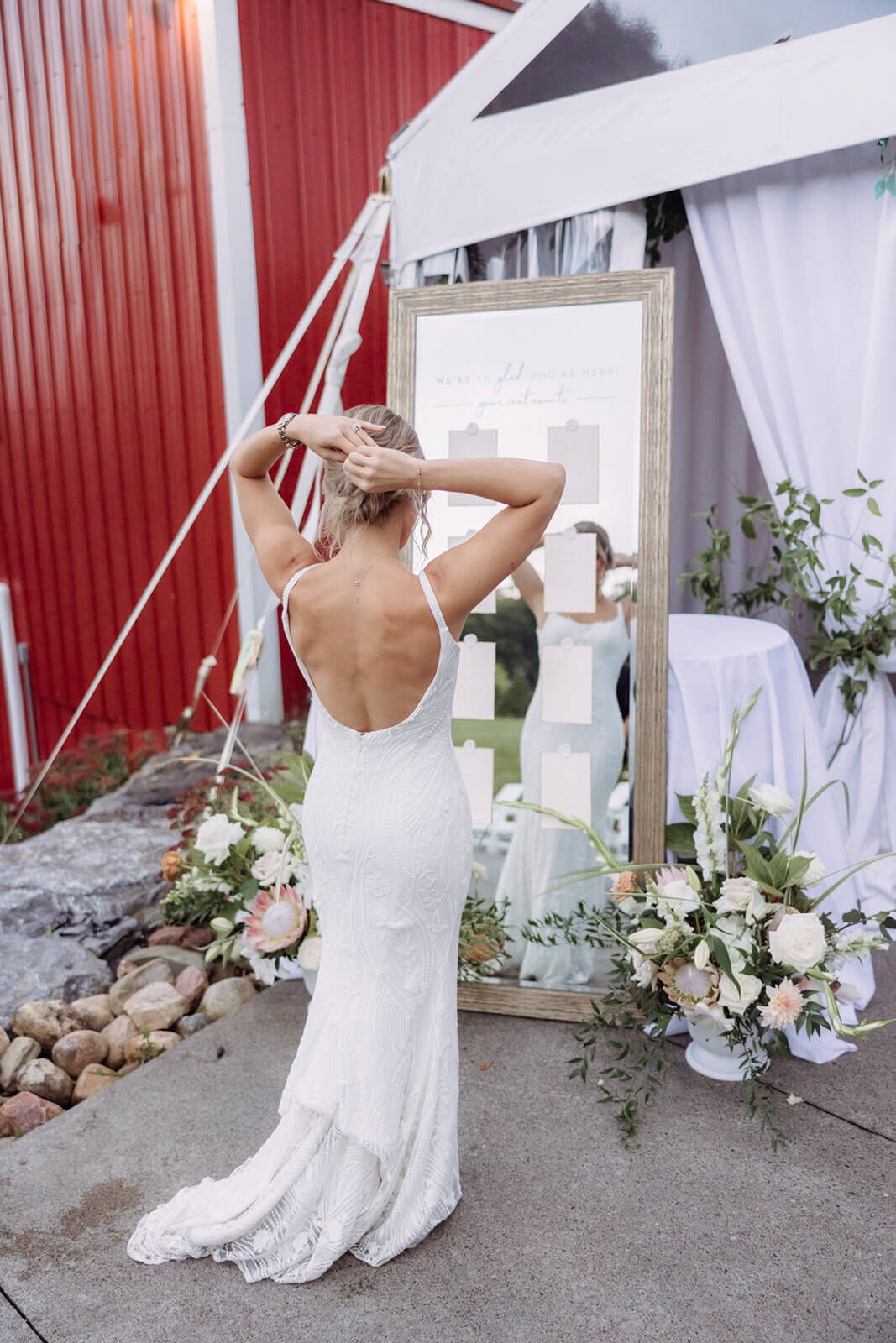 Bride fixing hair at Finger Lakes Wedding
