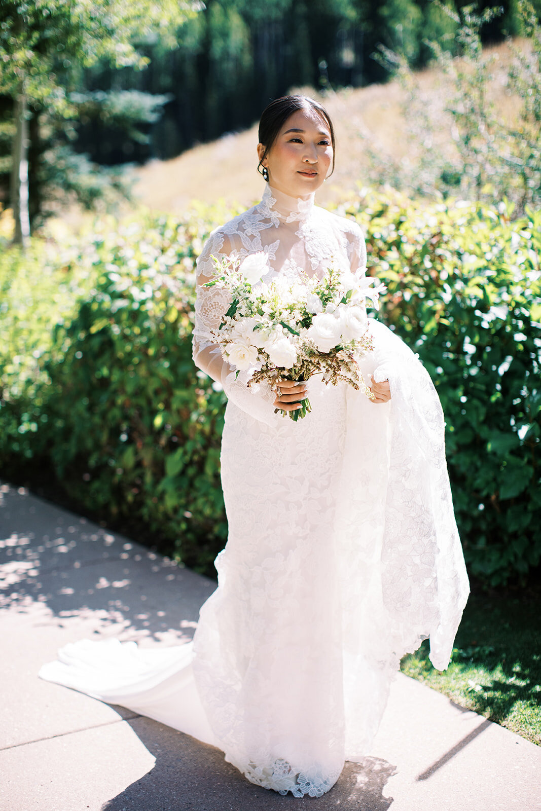 bride goes to first look wearing lace long sleeve wedding dress