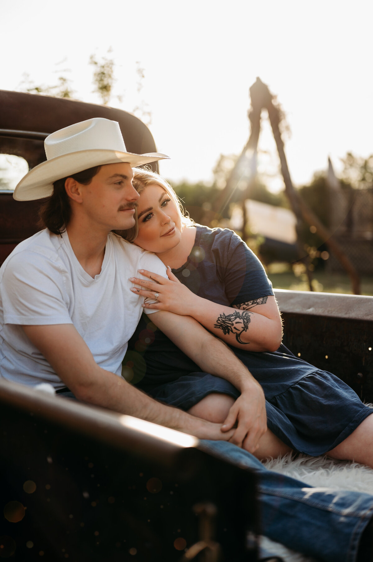 edmonton couple take engagement photographs in the back of their truck