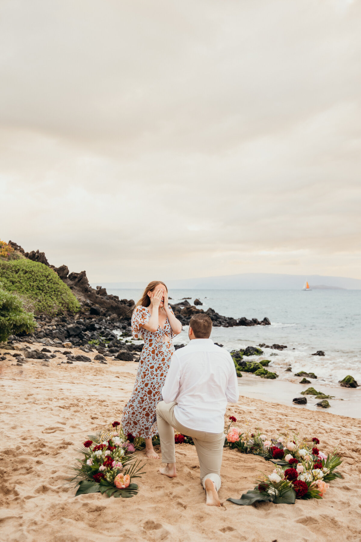 Hawaii Engagement Photographer captures man on one knee proposing to girlfriend