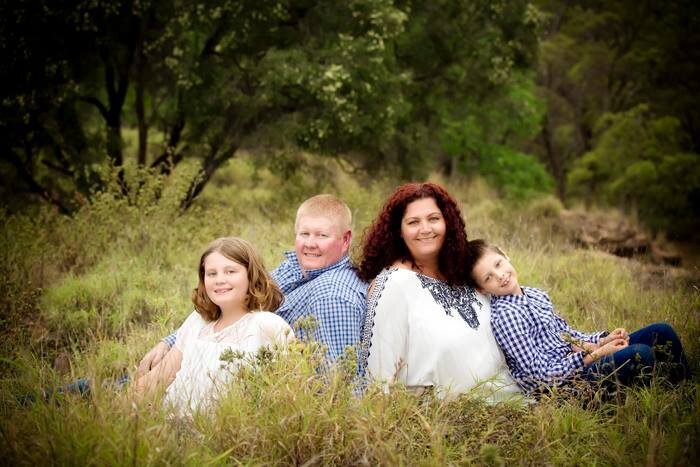 family in field Comet, QLD