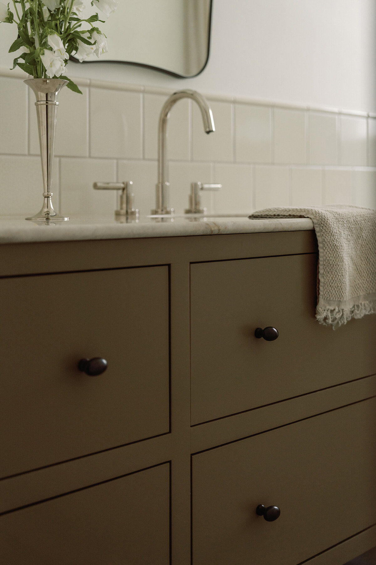 House-Franc-historical-bathroom-remodel-renovation-green-bronze-vanity-earthy-taj-mahal-quartzite-countertops-nickel-bell-flowers-fireclay-tile-crackle-tile-traditional-modern-bathroom-phylrich-bronze-knobs-warm-cozy-austin-texas