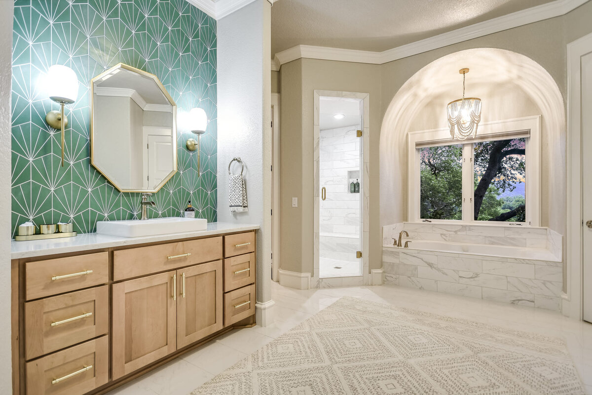 Large bathroom with luxury bathtub and green decorative tile