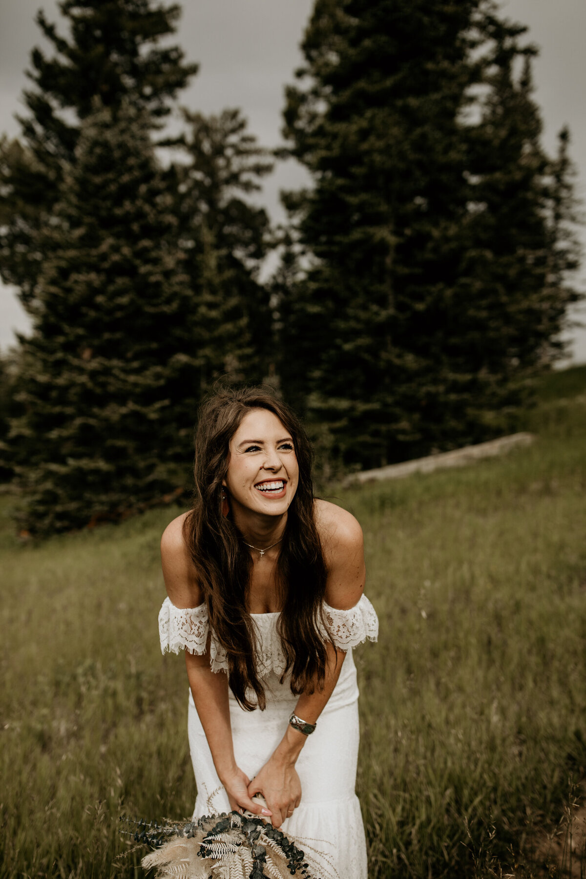 bride laughing at Sandia Peak in New Mexico