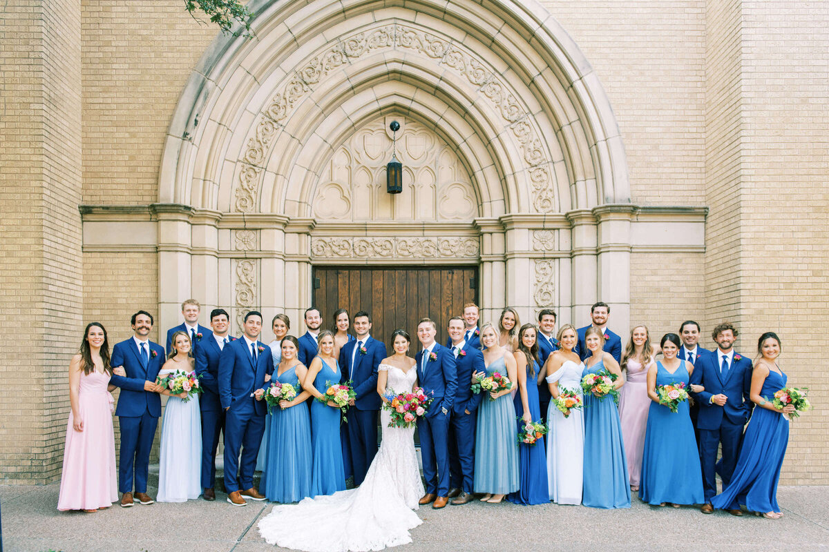 Large wedding party at colorful summer wedding in North Texas