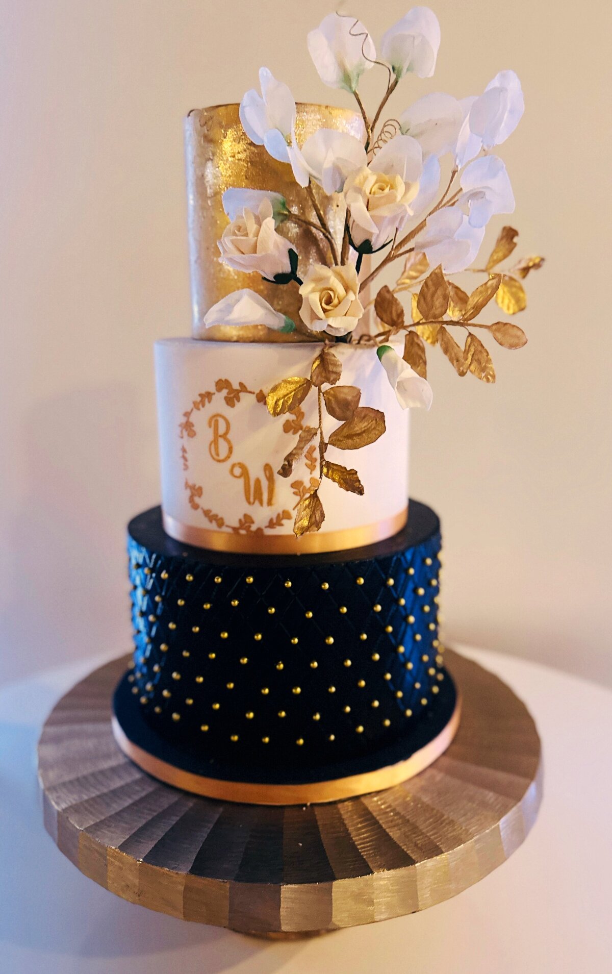 black and gold tiered wedding cake