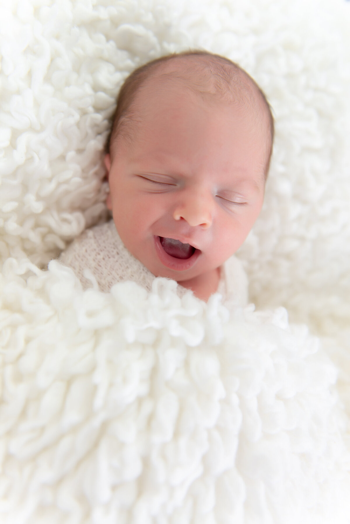 Newborn baby boy smiling in Kennebunk Maine