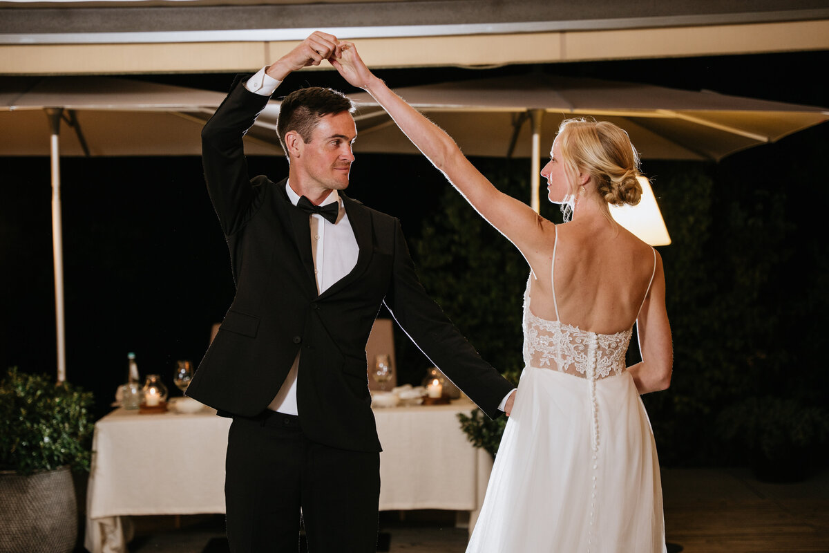 Bride and groom smiling during first dance