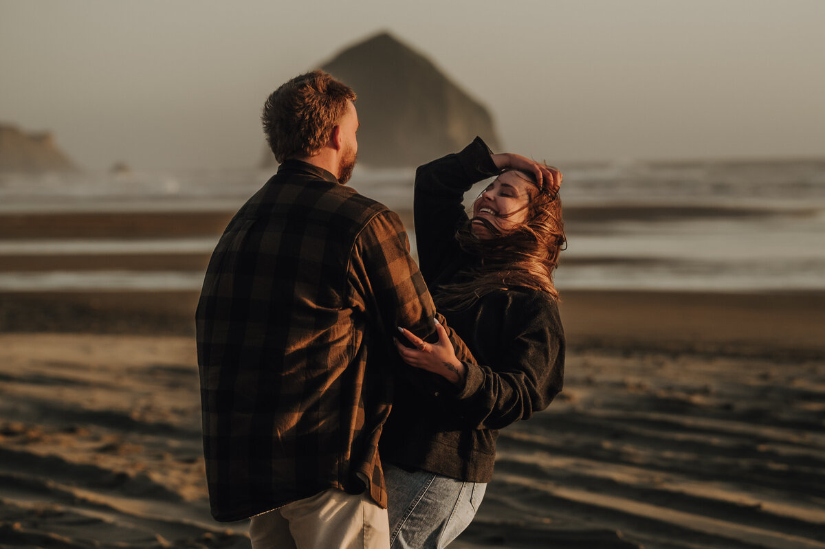 Couple dancing on Canon Beach in Oregon