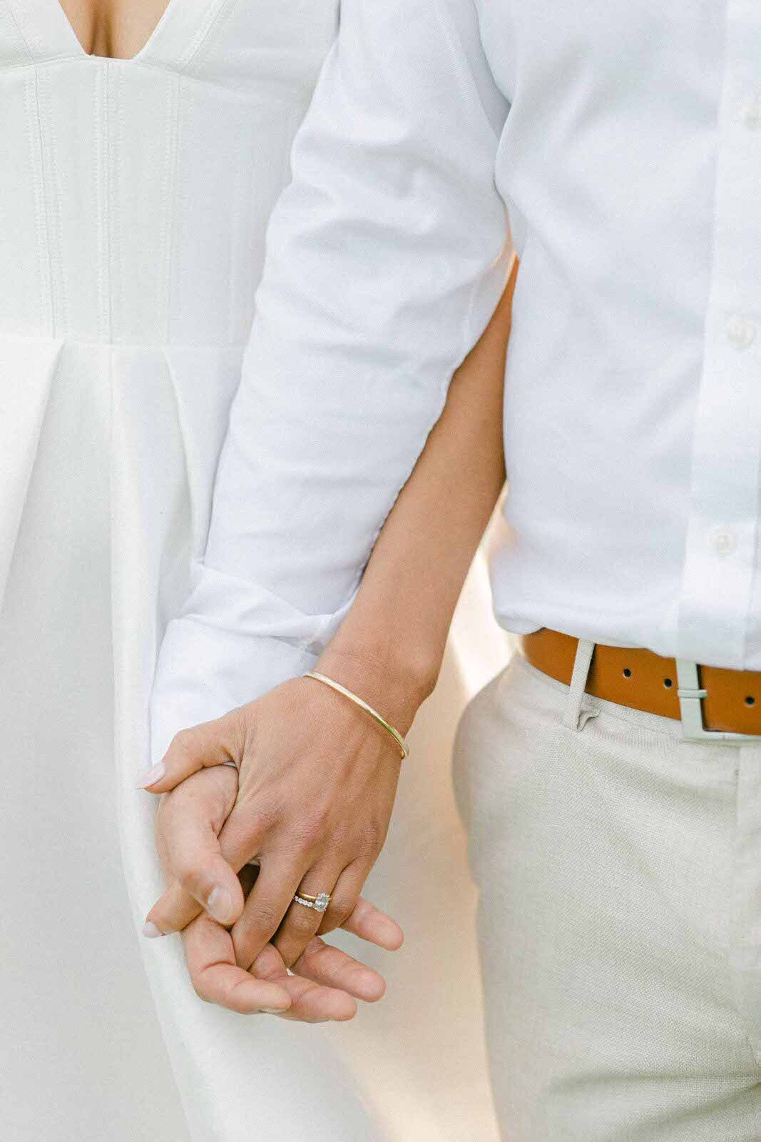 wedding couple holding their hands