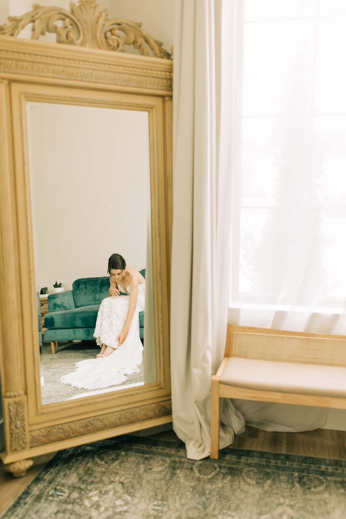 bride putting shoes on