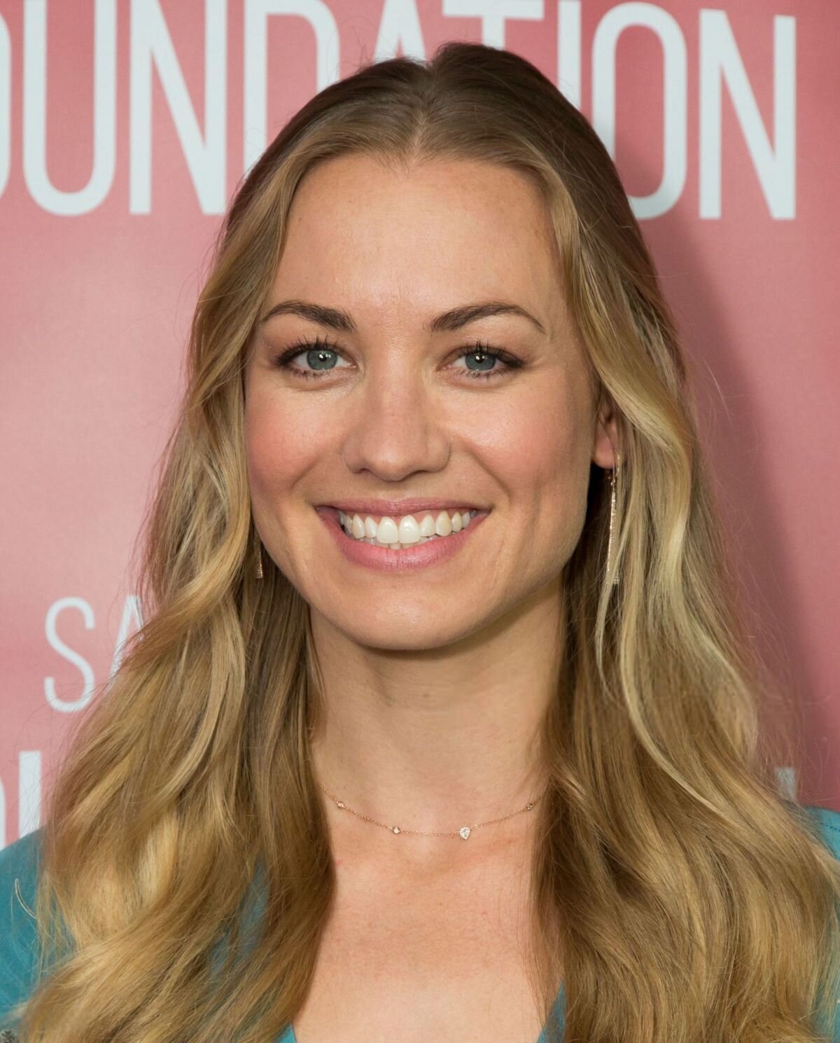 Yvonne Strahovski  wearing pink lipstick and smiling