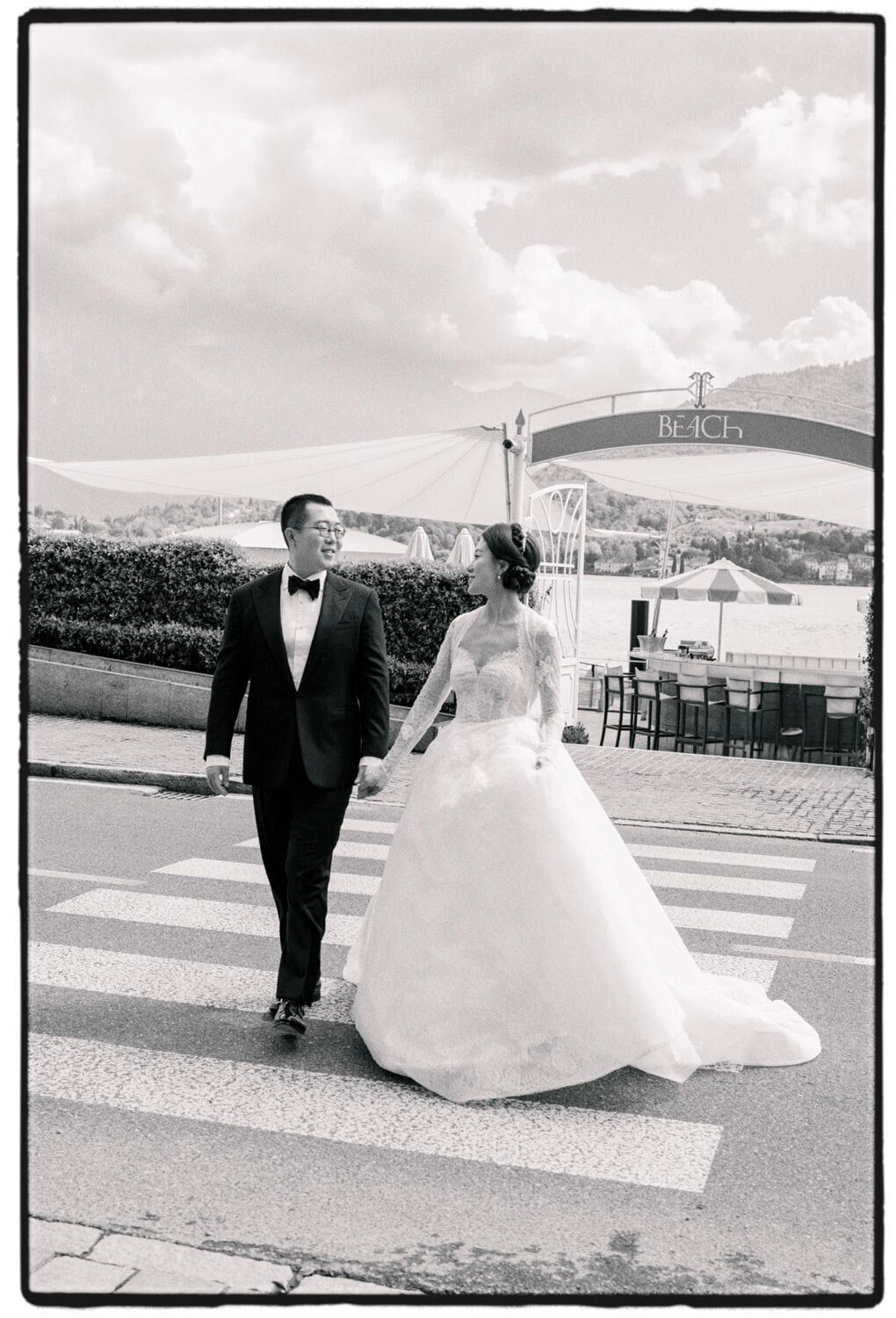 Beach-side wedding portraits of a couple during Grand Hotel Tremezzo wedding, by Lake Como Wedding Photographer Andreas K. Georgiou