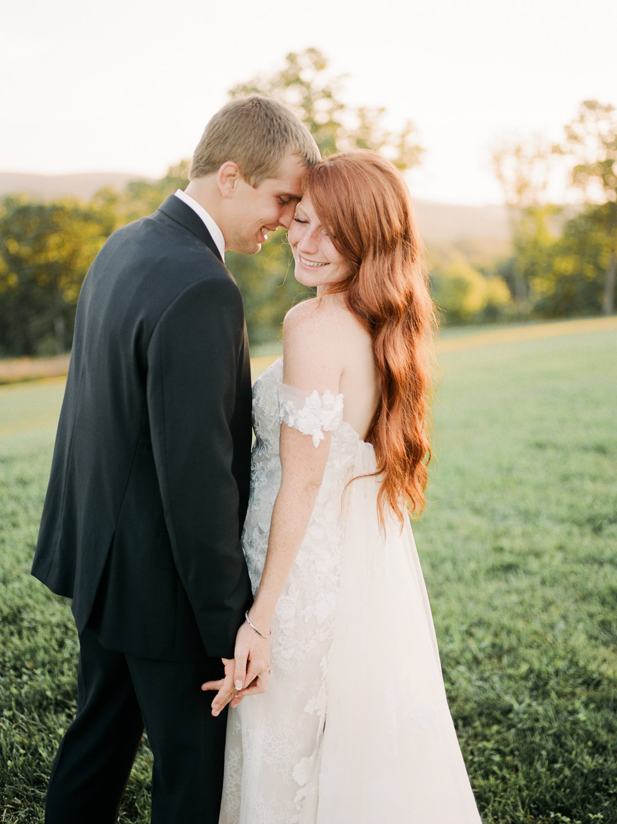 man and woman on wedding day holding hands