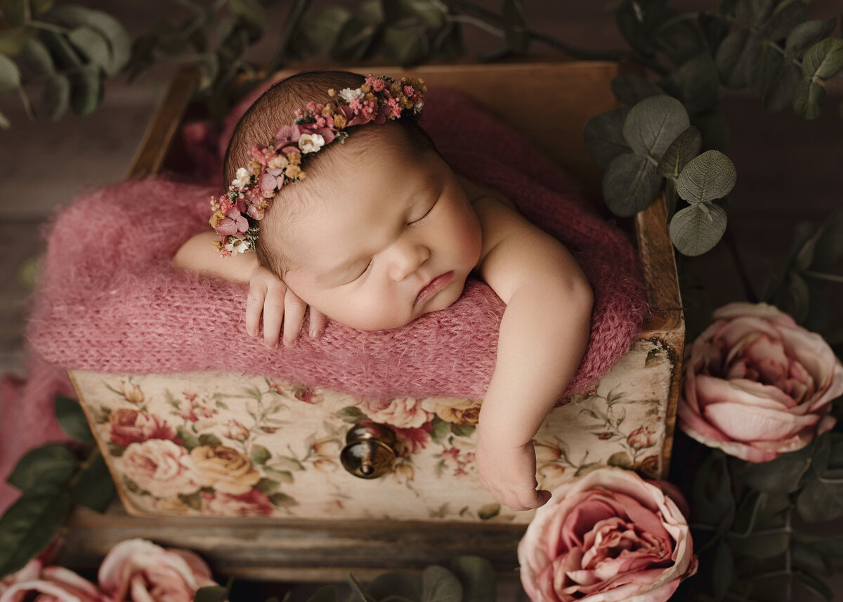 newborn-baby-girl-in-blush-pink-posed-in-a-drawer-prop-with-florals-ny