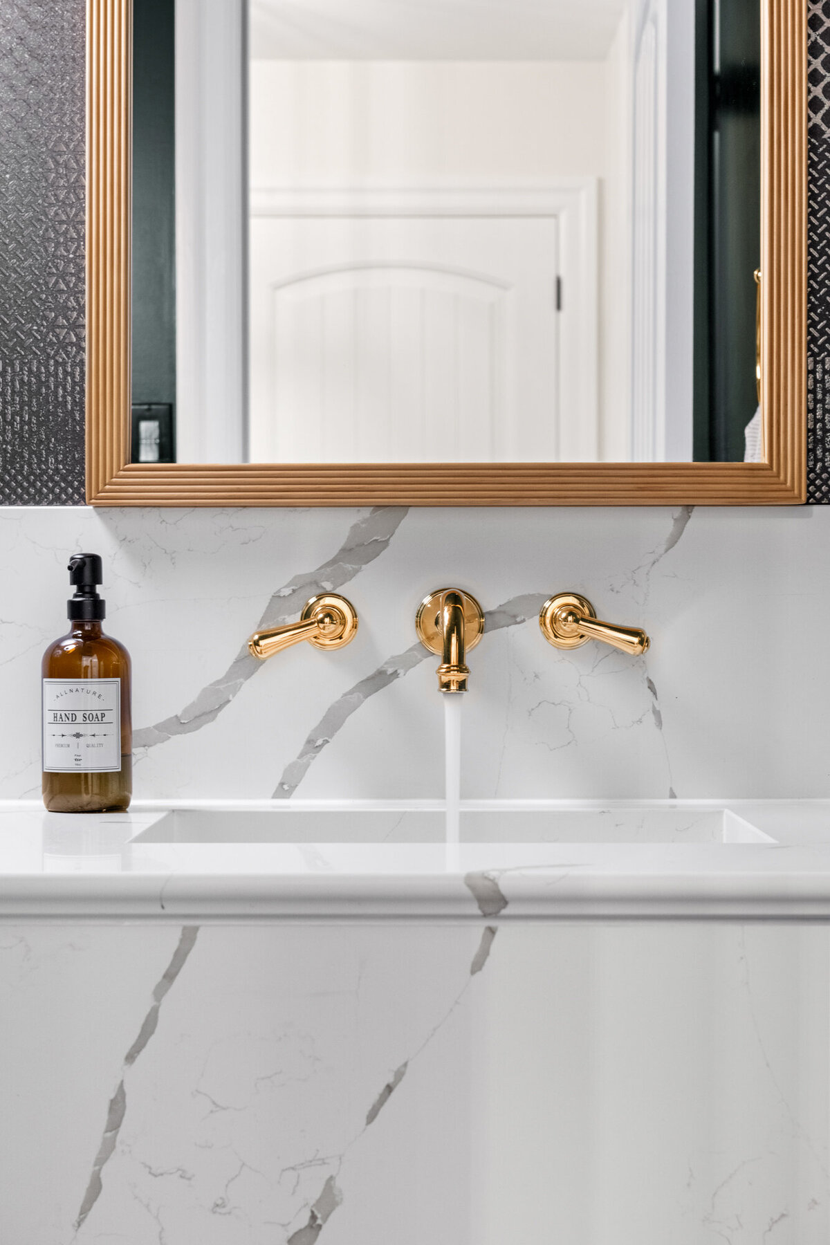 Final image of our moody luxe powder room interior design project.